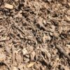 Layer of organic wood chip mulch in a garden bed in Pretoria.